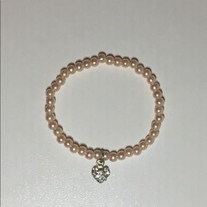 This is a elegant light pink colored bracelet